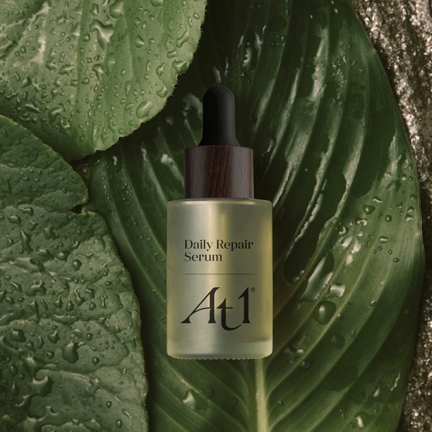 Dail Serum bottle with jungle leaves behind it