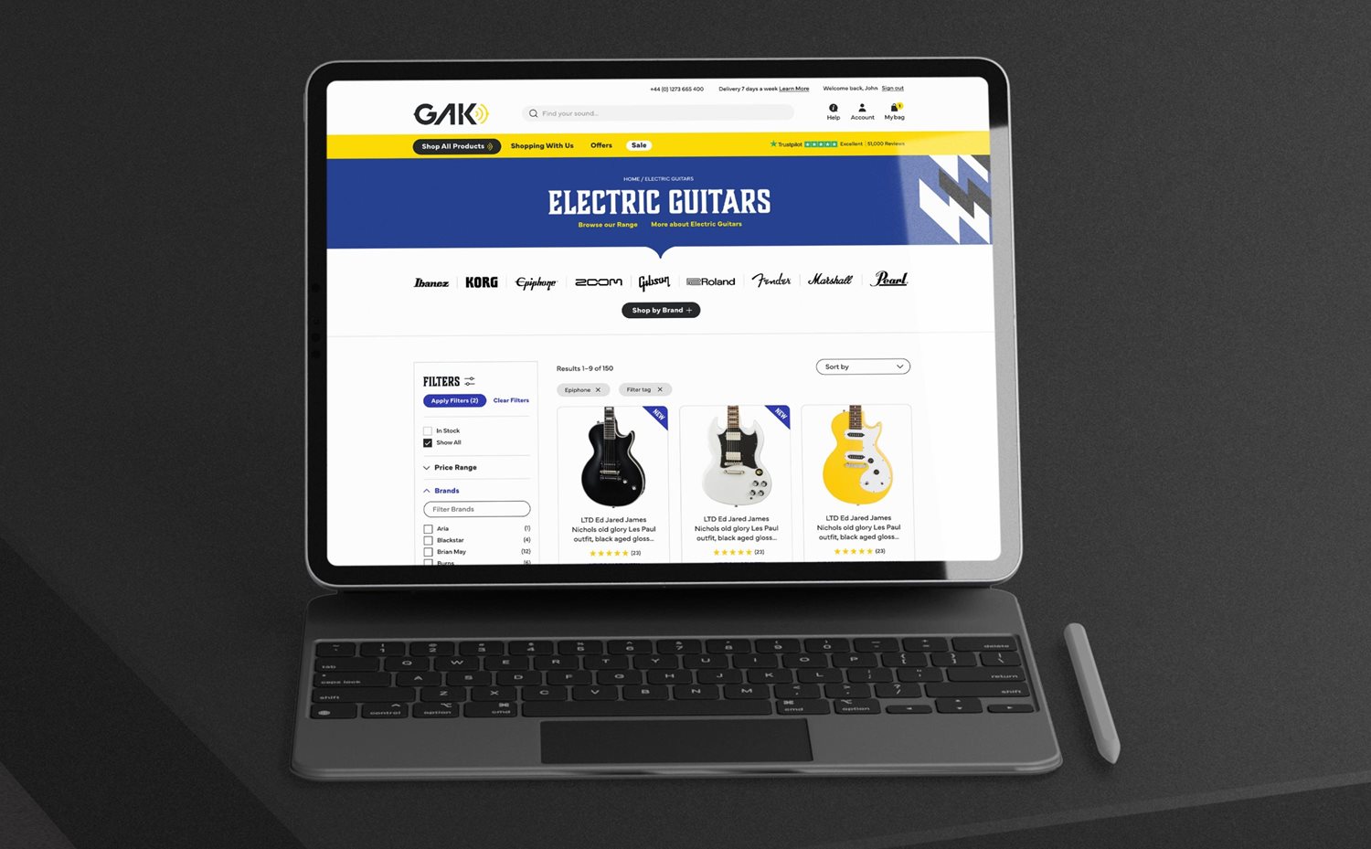 Category page (guitars) on a laptop